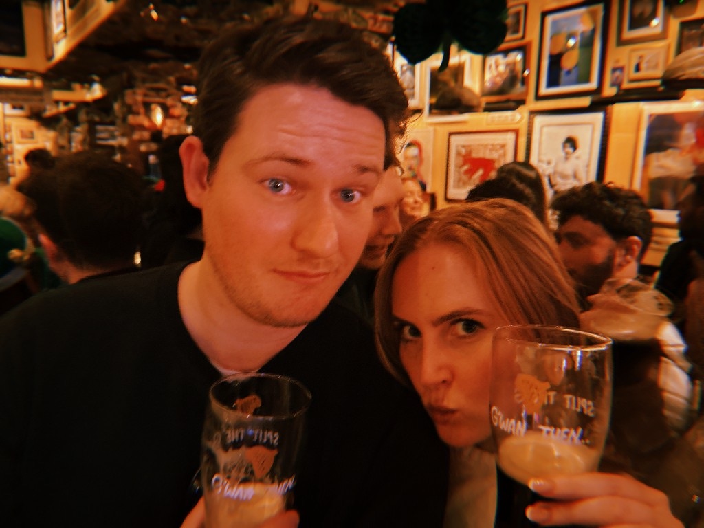 Laura and Andrew with pints at a pub in Ireland